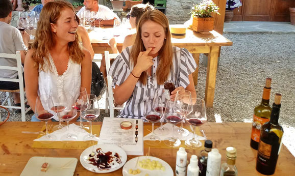 People having fun at their Tuscany wine tasting