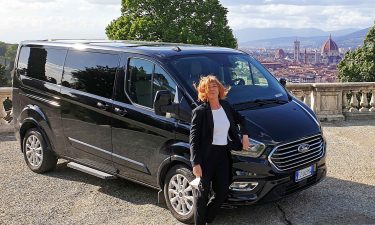 Myriam and her tour van in Tuscany